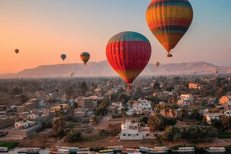 Balloons drifting over West Bank villages at dawn