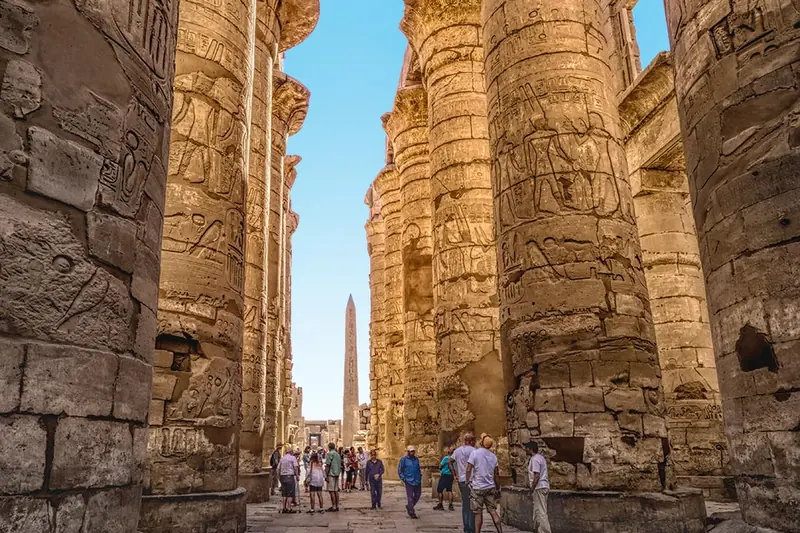 Visitors among the giant columns of Karnak’s Great Hypostyle Hall