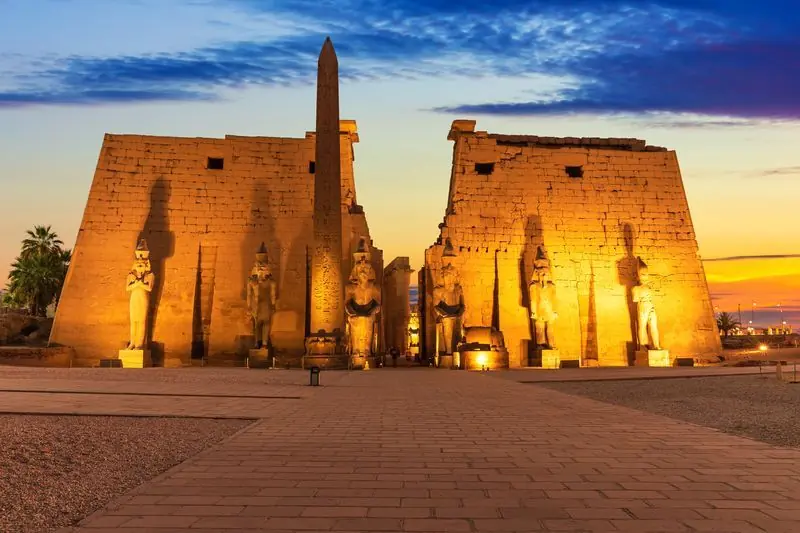 The entrance pylon and obelisk of Luxor Temple at dusk